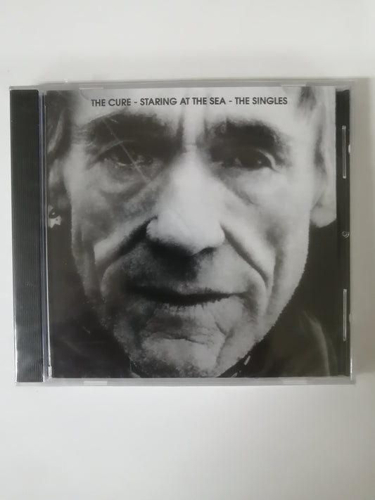 CD THE CURE - STARING AT THE SEA - THE SINGLES