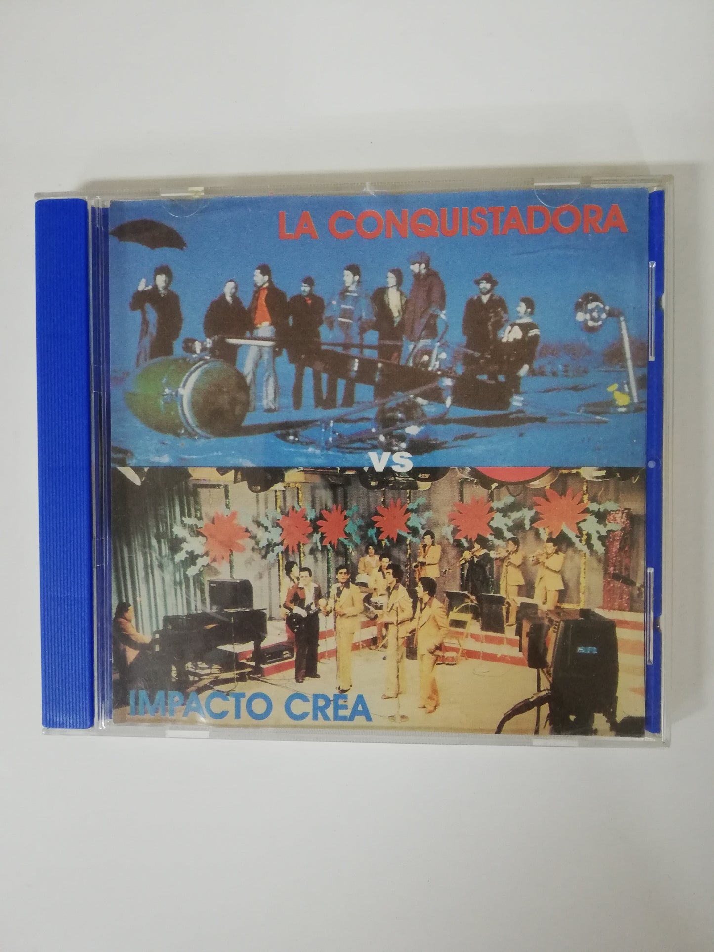 CD LA CONQUISTADORA / IMPACTO CREA - DUELO MUSICAL
